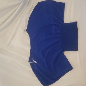 A blue flow shirt. Size medium from papaya. Great for an interview. Never worn